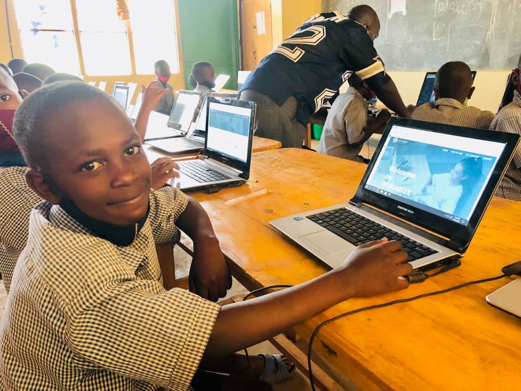 Happy Students Using SomaBox on a laptop